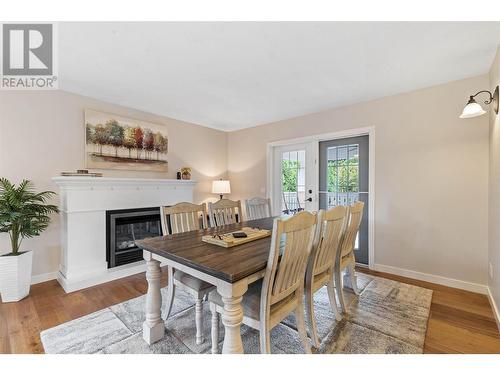 414 Curlew Drive, Kelowna, BC - Indoor Photo Showing Dining Room With Fireplace