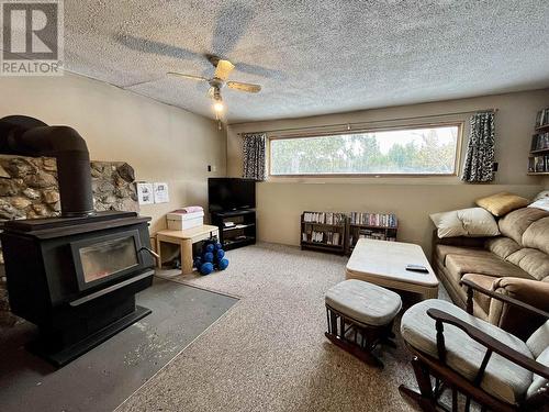 2987 Likely Road, 150 Mile House, BC - Indoor Photo Showing Living Room With Fireplace