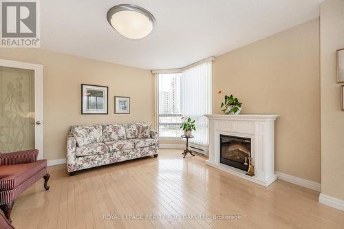 #201 -2170 Marine Dr, Oakville, ON - Indoor Photo Showing Living Room With Fireplace