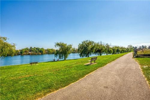 Walkway between Canal and conco building - 330 Prince Charles Drive S|Unit #1204, Welland, ON - Outdoor With Body Of Water With View