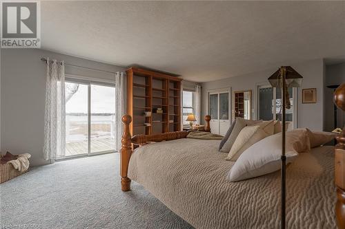Bedroom with Porch overlooking Lake Huron - 48 Petrel Point Road, South Bruce Peninsula, ON - Indoor Photo Showing Bedroom