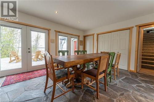 Dining Room with a wall of windows looking out to Lake Huron - 48 Petrel Point Road, South Bruce Peninsula, ON - Indoor Photo Showing Dining Room