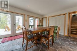 Dining Room with a wall of windows looking out to Lake Huron - 