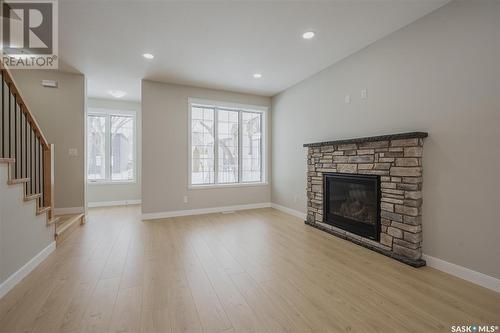 1112 9Th Street E, Saskatoon, SK - Indoor Photo Showing Living Room With Fireplace
