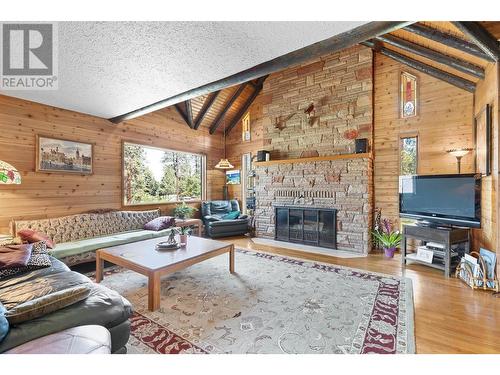 4610 Stewart Road E, Kelowna, BC - Indoor Photo Showing Living Room With Fireplace