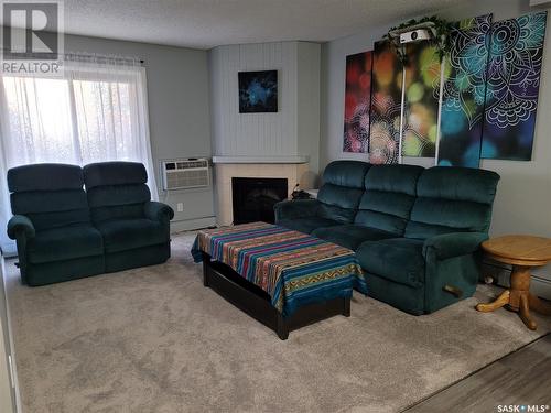 103G 1121 Mckercher Drive, Saskatoon, SK - Indoor Photo Showing Living Room With Fireplace
