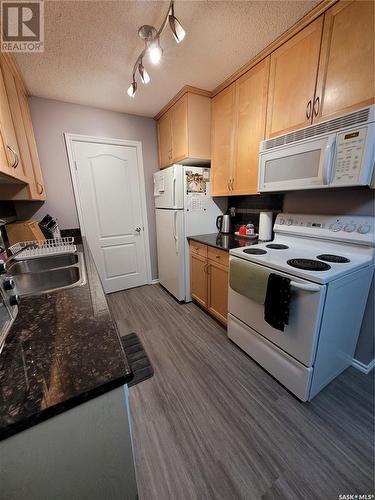 103G 1121 Mckercher Drive, Saskatoon, SK - Indoor Photo Showing Kitchen With Double Sink