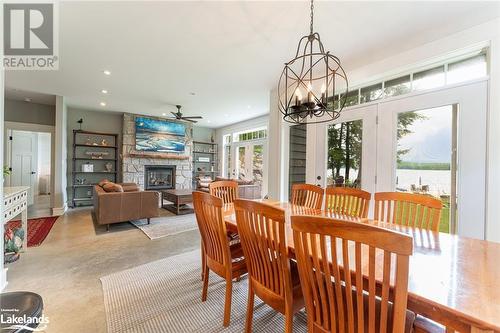 1154 Wilkinson Road, Haliburton, ON - Indoor Photo Showing Dining Room With Fireplace