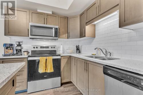 #412 -120 Summersides Blvd, Pelham, ON - Indoor Photo Showing Kitchen With Stainless Steel Kitchen With Double Sink With Upgraded Kitchen