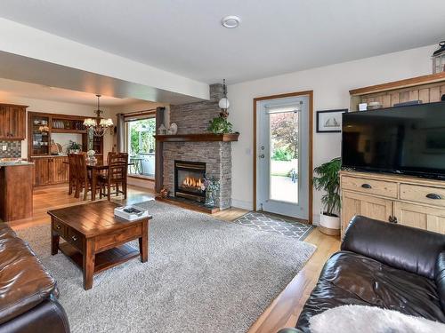 7372 Fintry Delta Road, Kelowna, BC - Indoor Photo Showing Living Room With Fireplace
