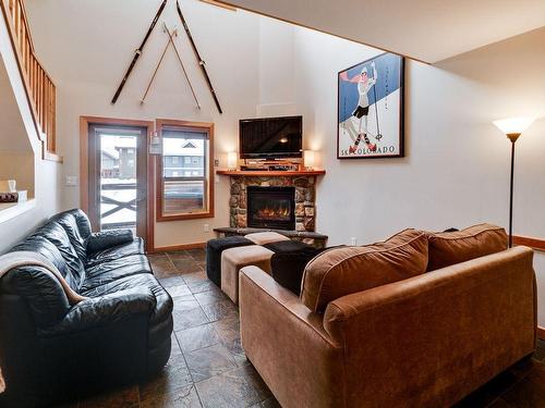 8-360 Strayhorse Road, Apex Mountain, BC - Indoor Photo Showing Living Room With Fireplace