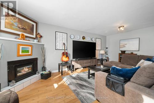 #1 -15 Progress Ave, Belleville, ON - Indoor Photo Showing Living Room With Fireplace