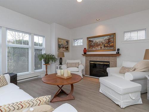 1-9877 Seventh St, Sidney, BC - Indoor Photo Showing Living Room With Fireplace