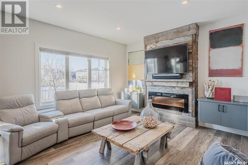 546 Secord Manor, Saskatoon, SK - Indoor Photo Showing Living Room With Fireplace