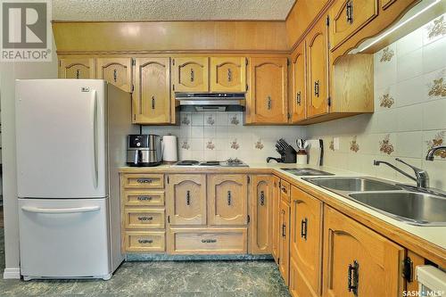 11 Wilkie Road, Regina, SK - Indoor Photo Showing Kitchen With Double Sink