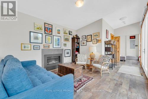 1008B Gordie Lane, North Frontenac, ON - Indoor Photo Showing Living Room With Fireplace