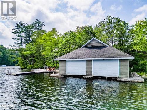 double boathouse - 1078A Lake Joseph Road, Seguin, ON - Outdoor With Body Of Water