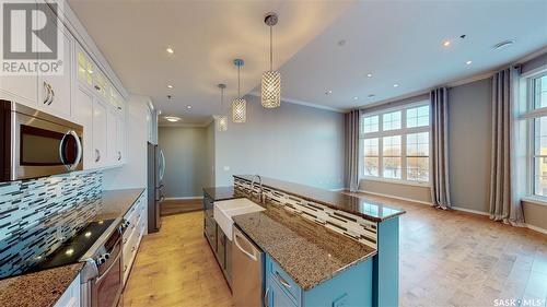 302 1715 Badham Boulevard, Regina, SK - Indoor Photo Showing Kitchen With Upgraded Kitchen