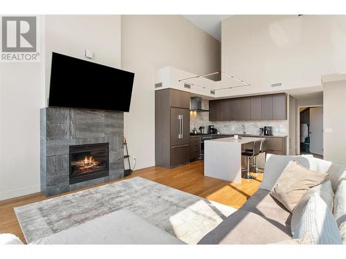 1289 Ellis Street Unit# 401, Kelowna, BC - Indoor Photo Showing Living Room With Fireplace
