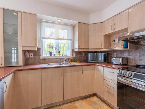 Kitchen - 8625 Rue Odessa, Brossard, QC - Indoor Photo Showing Kitchen With Double Sink