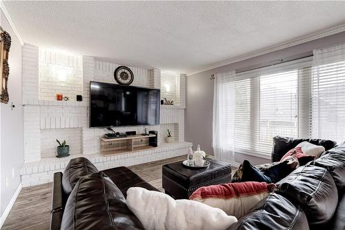 144 Solomon Crescent, Hamilton, ON - Indoor Photo Showing Living Room With Fireplace