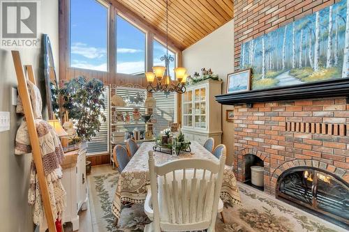 2463 Irvine Ave, Merritt, BC - Indoor Photo Showing Dining Room With Fireplace