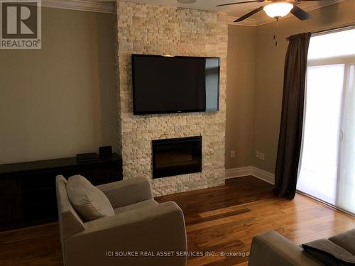 #1303 -240 Villagewalk Blvd, London, ON - Indoor Photo Showing Living Room With Fireplace