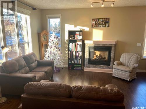 31 701 Mcintosh Street E, Swift Current, SK - Indoor Photo Showing Living Room With Fireplace