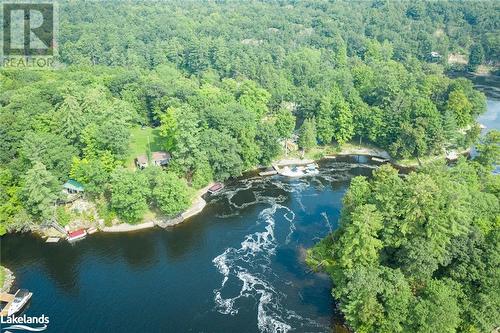 Unique location, with one side having a stronger, gentle current as the water travels north to the main Severn River channel - 5335 Claresbridge Lane, Washago, ON - Outdoor With Body Of Water With View