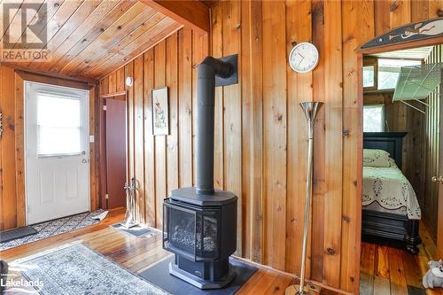 Propane Stove - 5335 Claresbridge Lane, Washago, ON - Indoor Photo Showing Other Room With Fireplace
