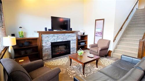 734 B - 700 Bighorn Boulevard, Radium Hot Springs, BC - Indoor Photo Showing Living Room With Fireplace