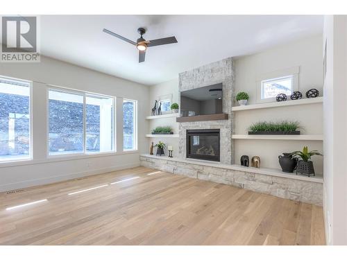 435 Vision Court, Kelowna, BC - Indoor Photo Showing Other Room With Fireplace