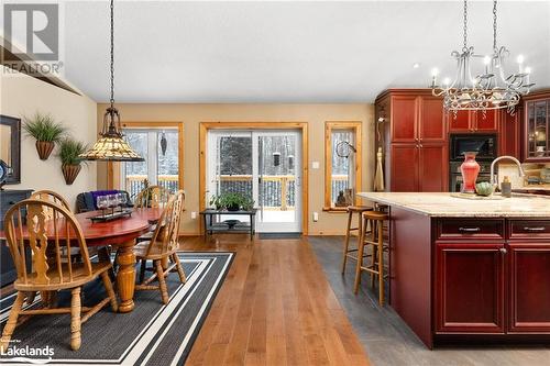 Dining Room & Kitchen with Walk-Out to Deck - 1083 Riding Ranch Road, Machar Twp, ON - Indoor