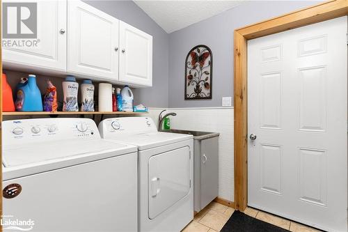Laundry with Garage access. - 1083 Riding Ranch Road, Machar Twp, ON - Indoor Photo Showing Laundry Room