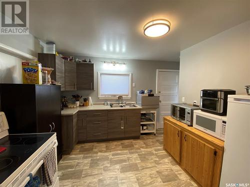 215 4Th Avenue W, Kindersley, SK - Indoor Photo Showing Kitchen With Double Sink