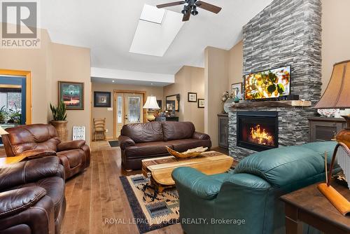 1083 Riding Ranch Rd E, Machar, ON - Indoor Photo Showing Living Room With Fireplace
