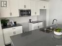 1007 Brighton Gate, Saskatoon, SK  - Indoor Photo Showing Kitchen With Double Sink 
