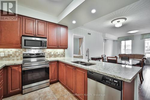 303 - 10101 Yonge Street, Richmond Hill, ON - Indoor Photo Showing Kitchen With Double Sink