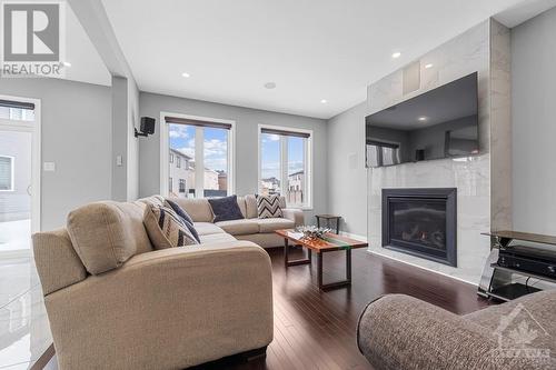 1005 Jubilation Court, Ottawa, ON - Indoor Photo Showing Living Room With Fireplace