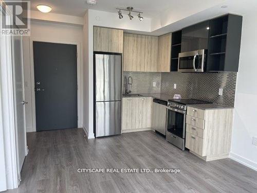 #414 -10 De Boers Dr, Toronto, ON - Indoor Photo Showing Kitchen With Upgraded Kitchen