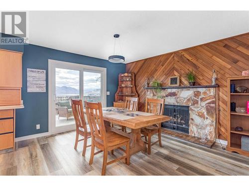 2247 Westville Way, West Kelowna, BC - Indoor Photo Showing Dining Room With Fireplace
