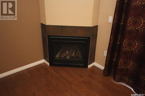 501 1901 Victoria Avenue, Regina, SK - Indoor Photo Showing Living Room With Fireplace