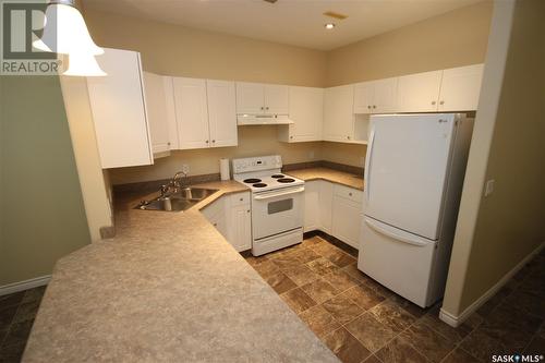 204 1901 Victoria Avenue, Regina, SK - Indoor Photo Showing Kitchen With Double Sink