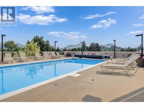 1160 Bernard Avenue Unit# 102, Kelowna, BC - Outdoor With In Ground Pool