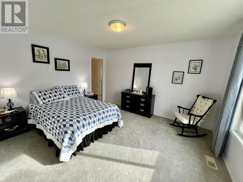 3474 Dunsmuir Road, Lac La Hache, BC - Indoor Photo Showing Bedroom