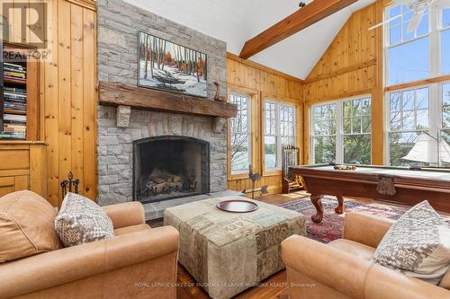 5 - 1019 Bluff Road, Muskoka Lakes, ON - Indoor Photo Showing Living Room With Fireplace