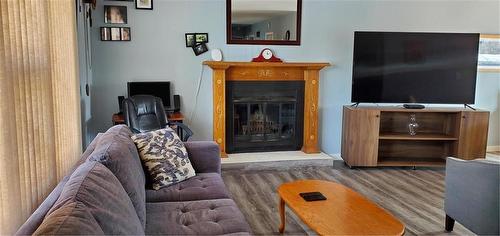 747 7Th Street, Brandon, MB - Indoor With Fireplace