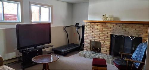 747 7Th Street, Brandon, MB - Indoor With Fireplace