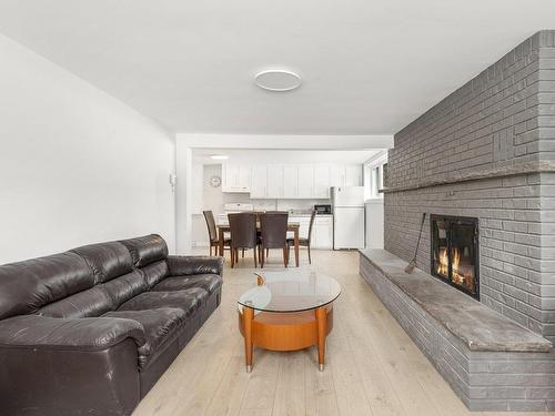 Intergenerational - 648 Place Roussin, Joliette, QC - Indoor Photo Showing Living Room With Fireplace