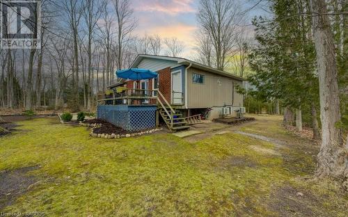 Side of house, large yard! - 16 Pine Forest Drive, Sauble Beach, ON - Outdoor With Deck Patio Veranda